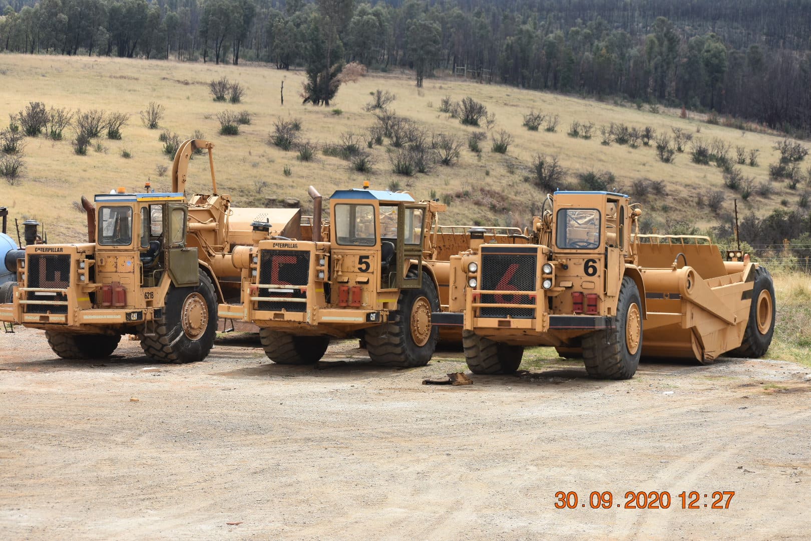 A Fleet of Caterpillar 621B Scrapers