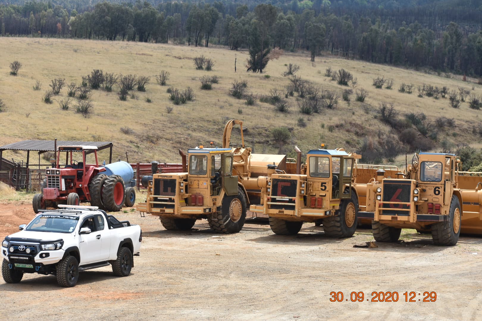 A Fleet of Caterpillar 621B Scrapers