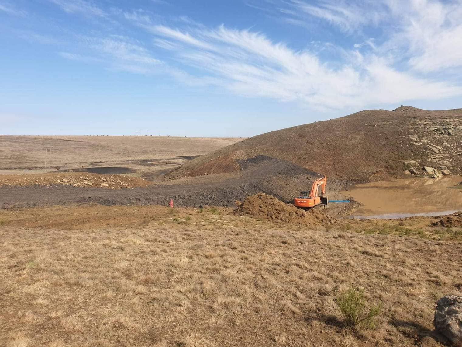 Hitachi Excavator Building An Earth Wall Dam